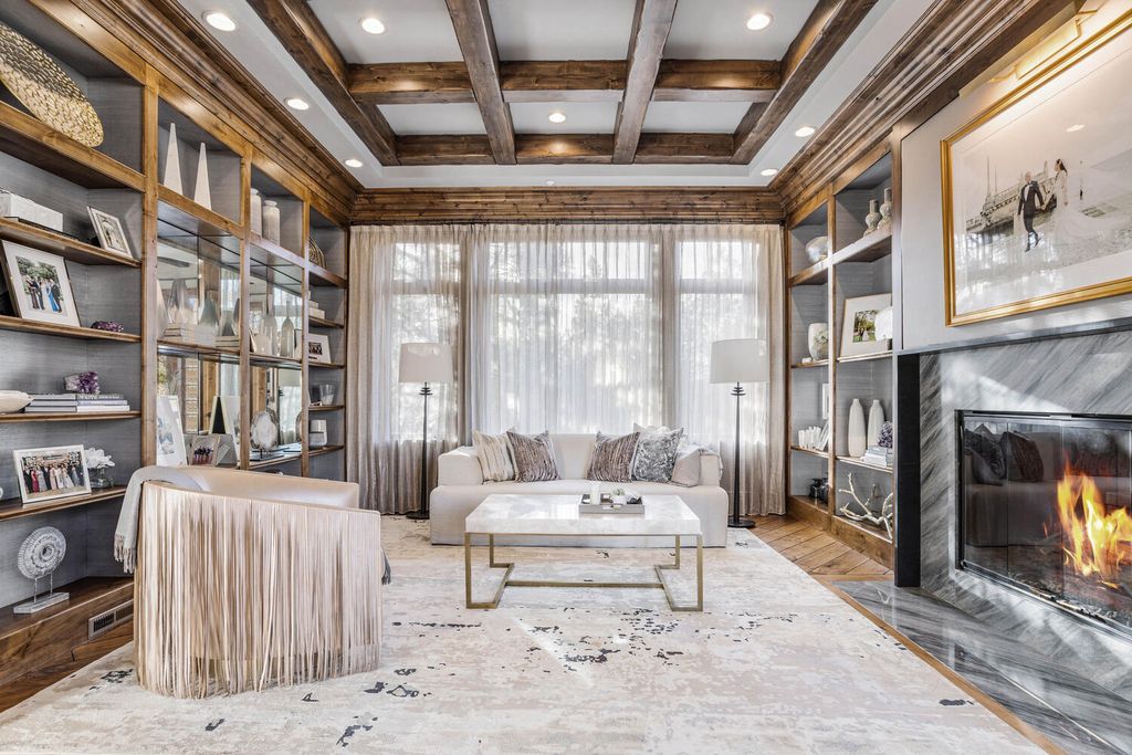 4 Eagle Pointe Lane, Castle Rock, Colorado is a a stunning renovation of a 2003 Trillium Home with the sweeping layout, along with dramatic wall and ceiling treatments, immaculate wood features, multiple fireplaces, and high-end designer finishes.