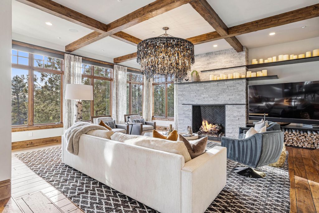4 Eagle Pointe Lane, Castle Rock, Colorado is a a stunning renovation of a 2003 Trillium Home with the sweeping layout, along with dramatic wall and ceiling treatments, immaculate wood features, multiple fireplaces, and high-end designer finishes.