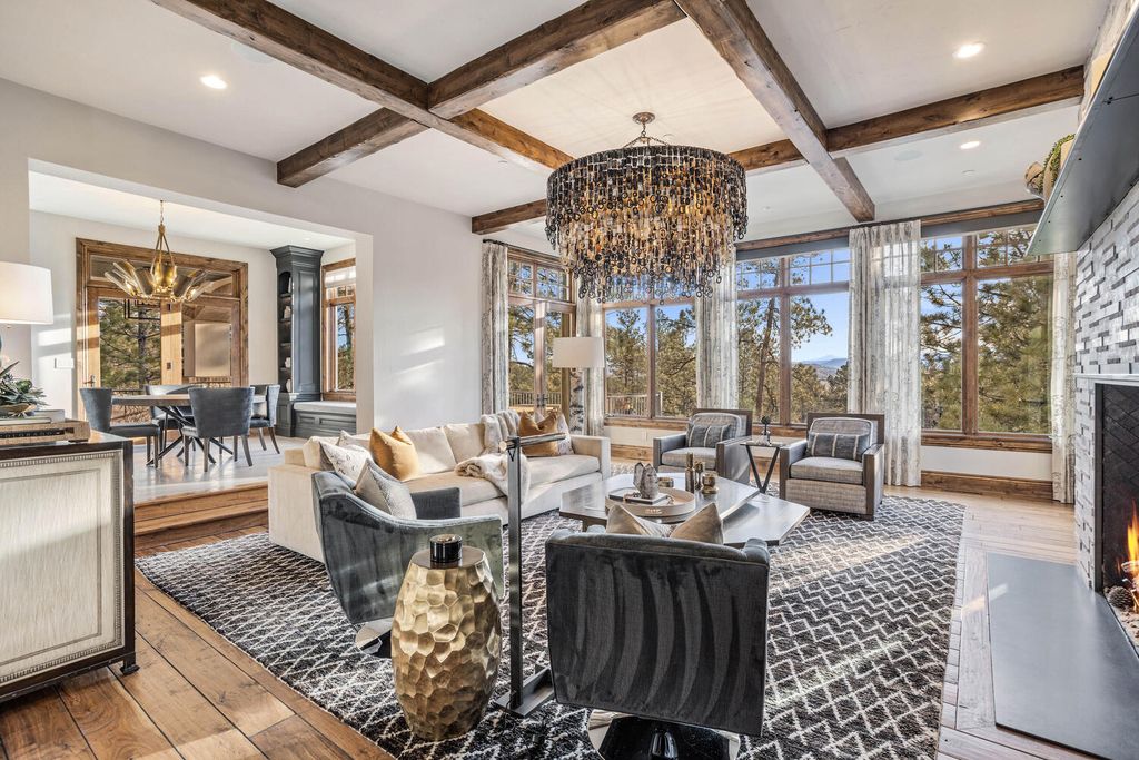 4 Eagle Pointe Lane, Castle Rock, Colorado is a a stunning renovation of a 2003 Trillium Home with the sweeping layout, along with dramatic wall and ceiling treatments, immaculate wood features, multiple fireplaces, and high-end designer finishes.