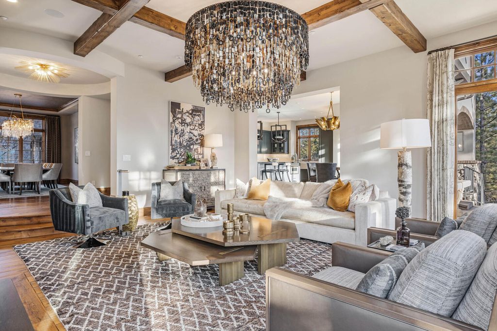 4 Eagle Pointe Lane, Castle Rock, Colorado is a a stunning renovation of a 2003 Trillium Home with the sweeping layout, along with dramatic wall and ceiling treatments, immaculate wood features, multiple fireplaces, and high-end designer finishes.