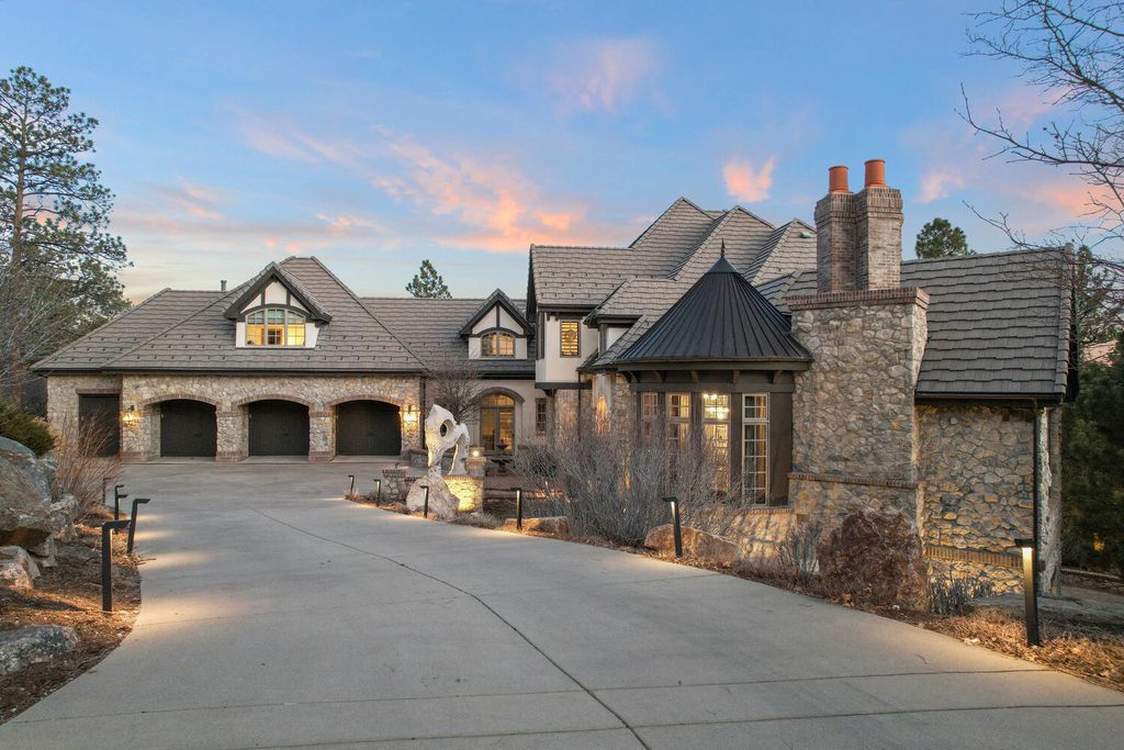 4 Eagle Pointe Lane, Castle Rock, Colorado is a a stunning renovation of a 2003 Trillium Home with the sweeping layout, along with dramatic wall and ceiling treatments, immaculate wood features, multiple fireplaces, and high-end designer finishes.