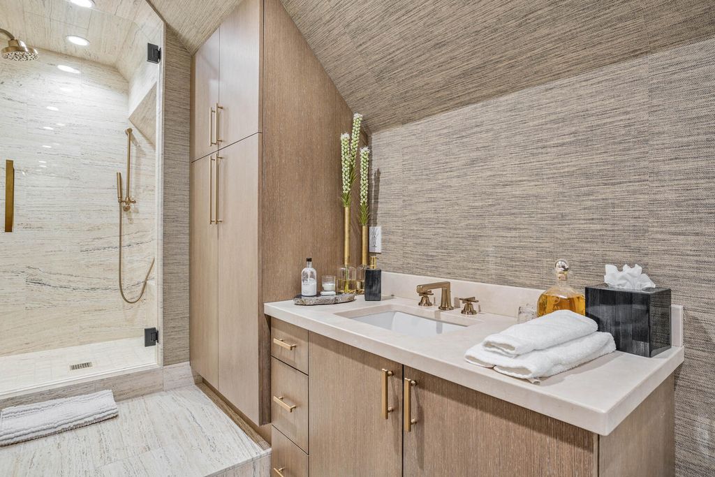 4 Eagle Pointe Lane, Castle Rock, Colorado is a a stunning renovation of a 2003 Trillium Home with the sweeping layout, along with dramatic wall and ceiling treatments, immaculate wood features, multiple fireplaces, and high-end designer finishes.