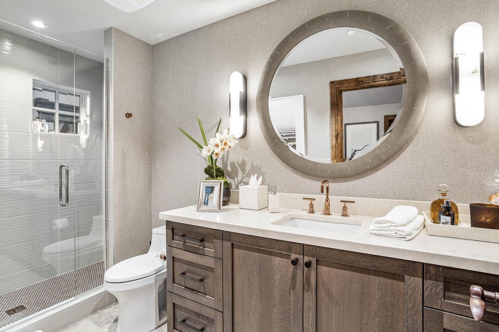 4 Eagle Pointe Lane, Castle Rock, Colorado is a a stunning renovation of a 2003 Trillium Home with the sweeping layout, along with dramatic wall and ceiling treatments, immaculate wood features, multiple fireplaces, and high-end designer finishes.