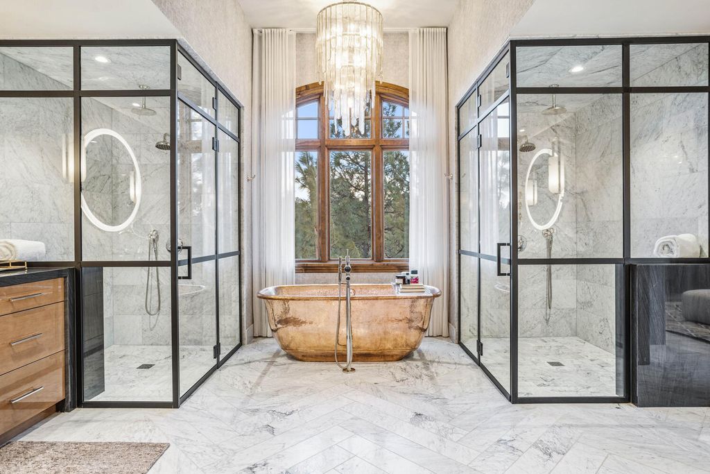 4 Eagle Pointe Lane, Castle Rock, Colorado is a a stunning renovation of a 2003 Trillium Home with the sweeping layout, along with dramatic wall and ceiling treatments, immaculate wood features, multiple fireplaces, and high-end designer finishes.