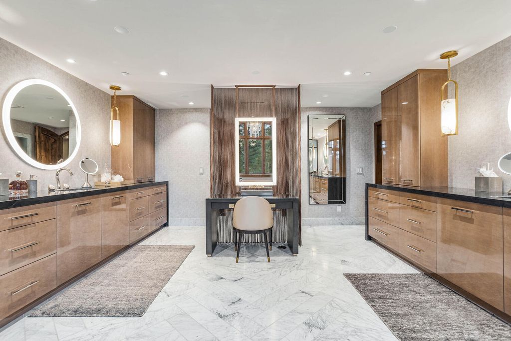 4 Eagle Pointe Lane, Castle Rock, Colorado is a a stunning renovation of a 2003 Trillium Home with the sweeping layout, along with dramatic wall and ceiling treatments, immaculate wood features, multiple fireplaces, and high-end designer finishes.