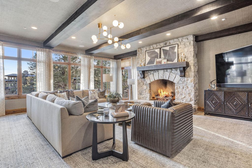 4 Eagle Pointe Lane, Castle Rock, Colorado is a a stunning renovation of a 2003 Trillium Home with the sweeping layout, along with dramatic wall and ceiling treatments, immaculate wood features, multiple fireplaces, and high-end designer finishes.