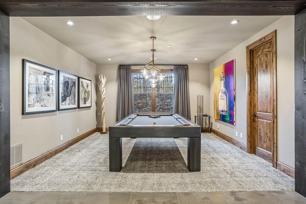 4 Eagle Pointe Lane, Castle Rock, Colorado is a a stunning renovation of a 2003 Trillium Home with the sweeping layout, along with dramatic wall and ceiling treatments, immaculate wood features, multiple fireplaces, and high-end designer finishes.