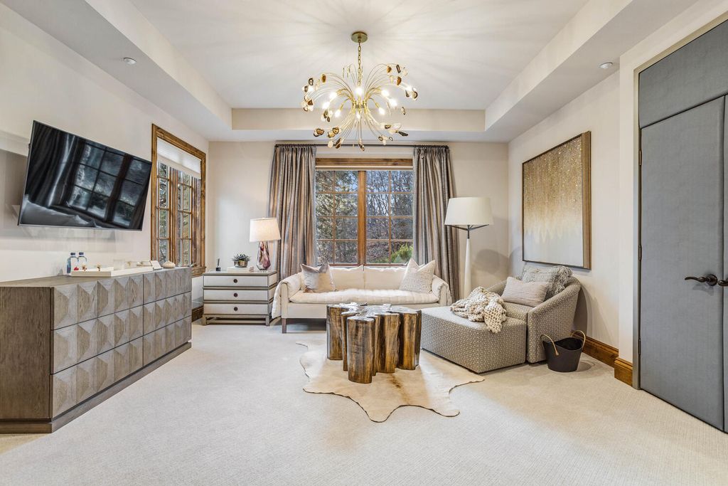 4 Eagle Pointe Lane, Castle Rock, Colorado is a a stunning renovation of a 2003 Trillium Home with the sweeping layout, along with dramatic wall and ceiling treatments, immaculate wood features, multiple fireplaces, and high-end designer finishes.