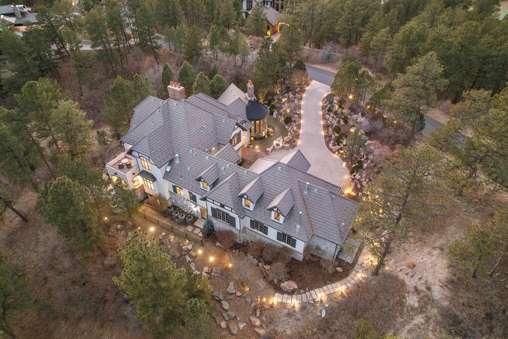 4 Eagle Pointe Lane, Castle Rock, Colorado is a a stunning renovation of a 2003 Trillium Home with the sweeping layout, along with dramatic wall and ceiling treatments, immaculate wood features, multiple fireplaces, and high-end designer finishes.