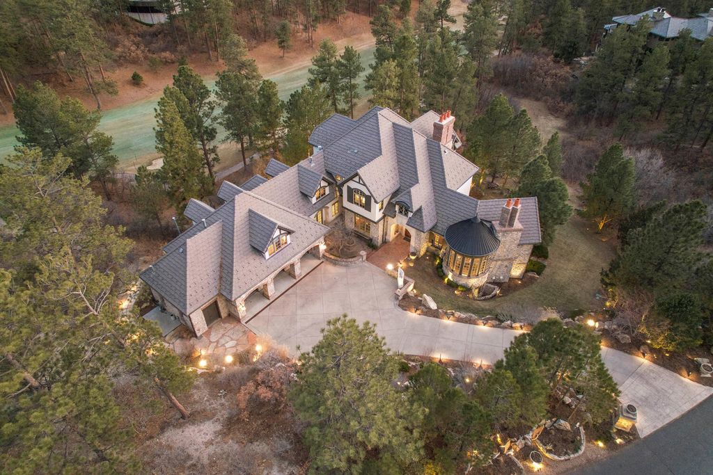 4 Eagle Pointe Lane, Castle Rock, Colorado is a a stunning renovation of a 2003 Trillium Home with the sweeping layout, along with dramatic wall and ceiling treatments, immaculate wood features, multiple fireplaces, and high-end designer finishes.