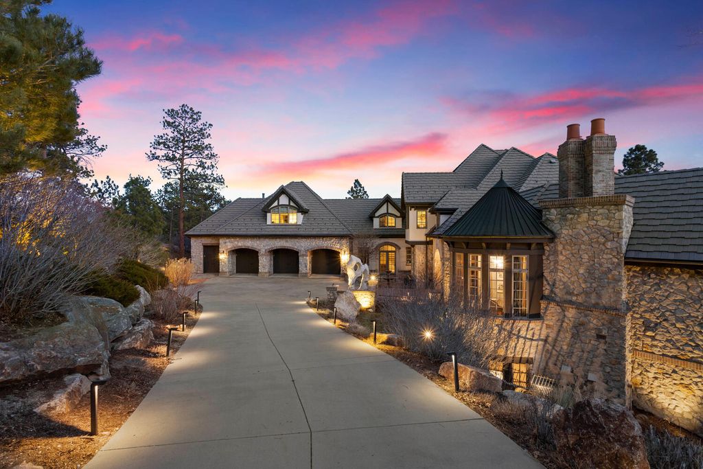 4 Eagle Pointe Lane, Castle Rock, Colorado is a a stunning renovation of a 2003 Trillium Home with the sweeping layout, along with dramatic wall and ceiling treatments, immaculate wood features, multiple fireplaces, and high-end designer finishes.