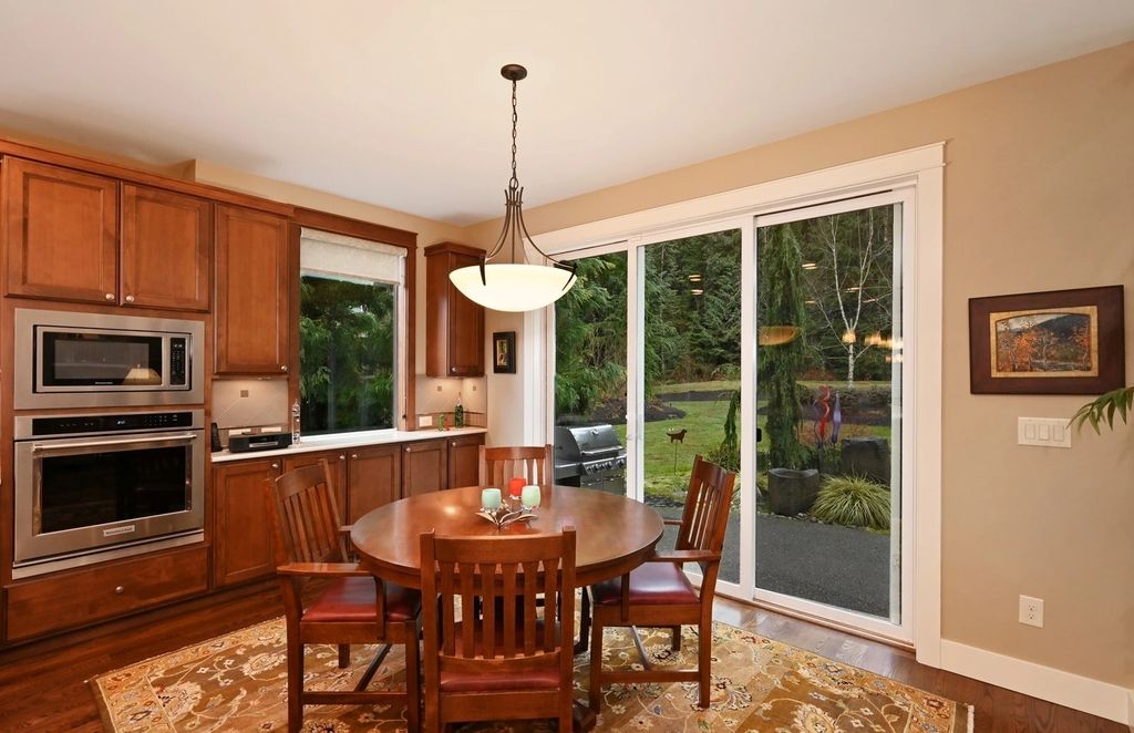 The Home in Redmond is a luxurious home with gracious room sizes and cozy spaces, now available for sale. This home located at 9215 255th Avenue NE, Redmond, Washington