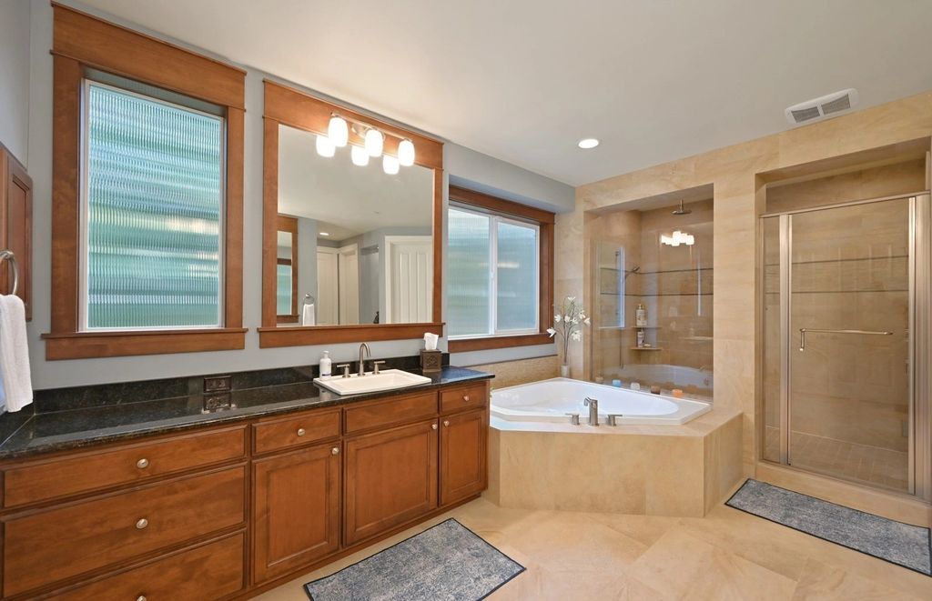 The Home in Redmond is a luxurious home with gracious room sizes and cozy spaces, now available for sale. This home located at 9215 255th Avenue NE, Redmond, Washington