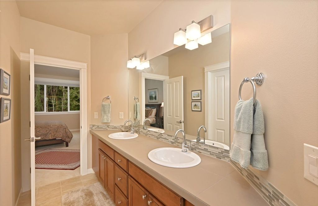 The Home in Redmond is a luxurious home with gracious room sizes and cozy spaces, now available for sale. This home located at 9215 255th Avenue NE, Redmond, Washington