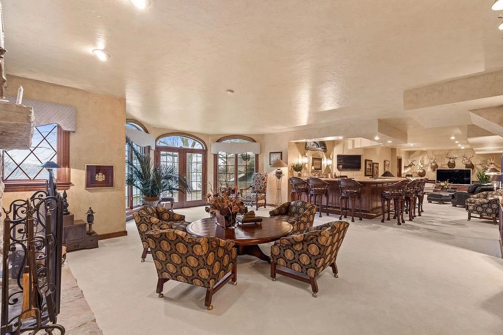 The Estate in Oconomowoc is a luxurious home with luxurious details throughout and unparalleled lakefront views now available for sale. This home located at 34595 Springbank Rd, Oconomowoc, Wisconsin; offering 04 bedrooms and 04 bathrooms with 5,694 square feet of living spaces.