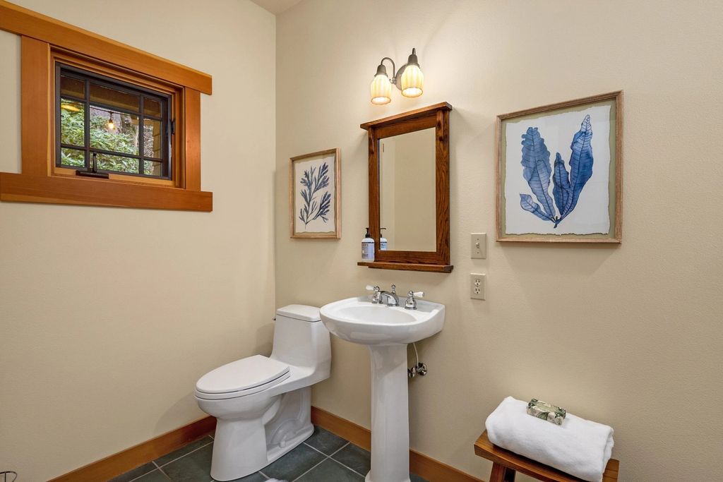 The Home in Bainbridge Island is an exceptional custom estate with 2 homes on a combined acre including 139’ of spectacular water frontage, now available for sale. This home located at 17253 & 17204 Agate Street NE, Bainbridge Island, Washington