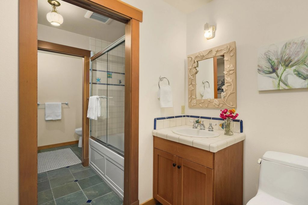 The Home in Bainbridge Island is an exceptional custom estate with 2 homes on a combined acre including 139’ of spectacular water frontage, now available for sale. This home located at 17253 & 17204 Agate Street NE, Bainbridge Island, Washington