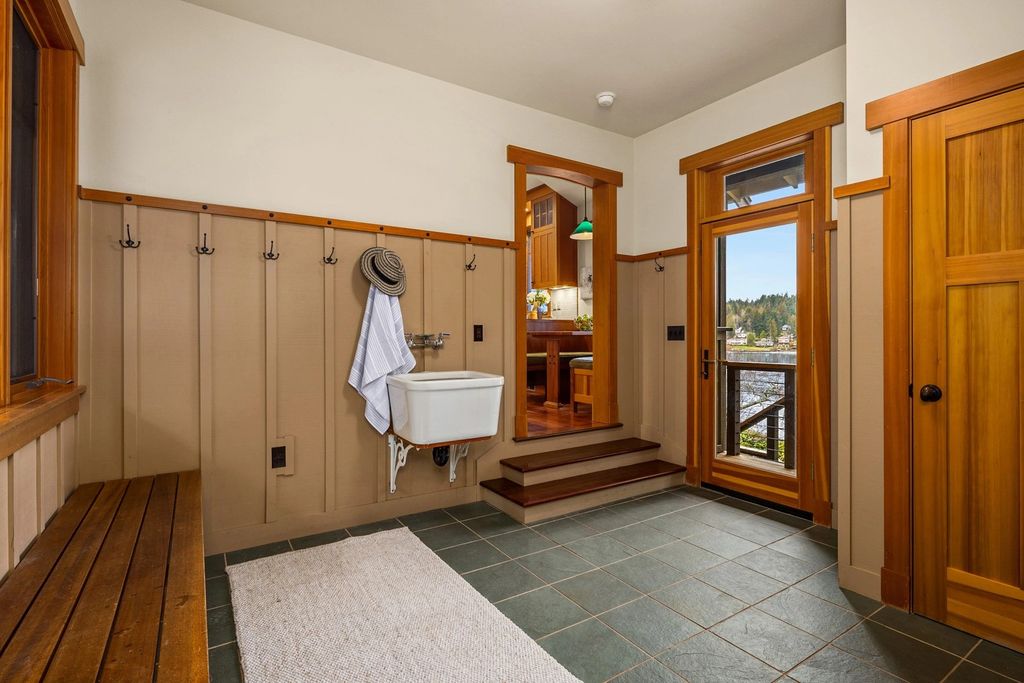 The Home in Bainbridge Island is an exceptional custom estate with 2 homes on a combined acre including 139’ of spectacular water frontage, now available for sale. This home located at 17253 & 17204 Agate Street NE, Bainbridge Island, Washington