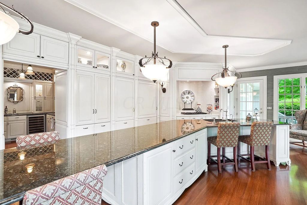 The Estate in Powell is a luxurious home providing grand living spaces with breathtaking woodland views and huge entertainment areas now available for sale. This home located at 1903 Strathshire Hall Ln, Powell, Ohio; offering 06 bedrooms and 08 bathrooms with 10,106 square feet of living spaces.