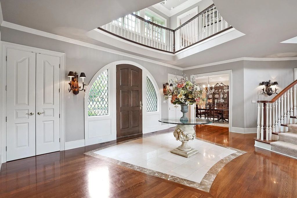 The Estate in Powell is a luxurious home providing grand living spaces with breathtaking woodland views and huge entertainment areas now available for sale. This home located at 1903 Strathshire Hall Ln, Powell, Ohio; offering 06 bedrooms and 08 bathrooms with 10,106 square feet of living spaces.