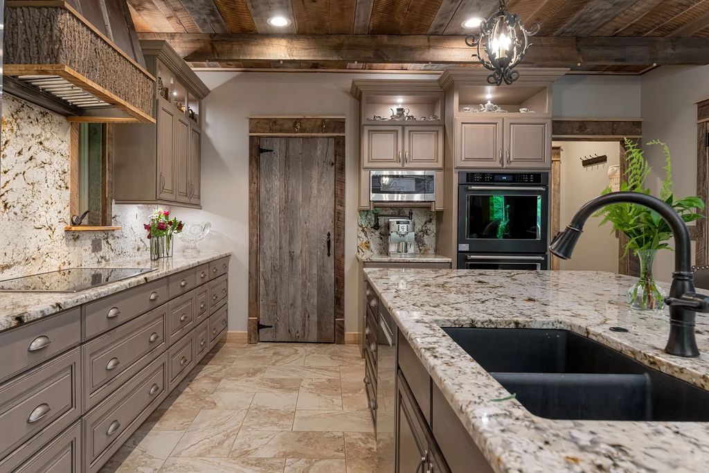 The Estate in Canton incorporates elements from the land with sustainable materials, now available for sale. This home located at 16 Gihon Waters Trl, Canton, North Carolina
