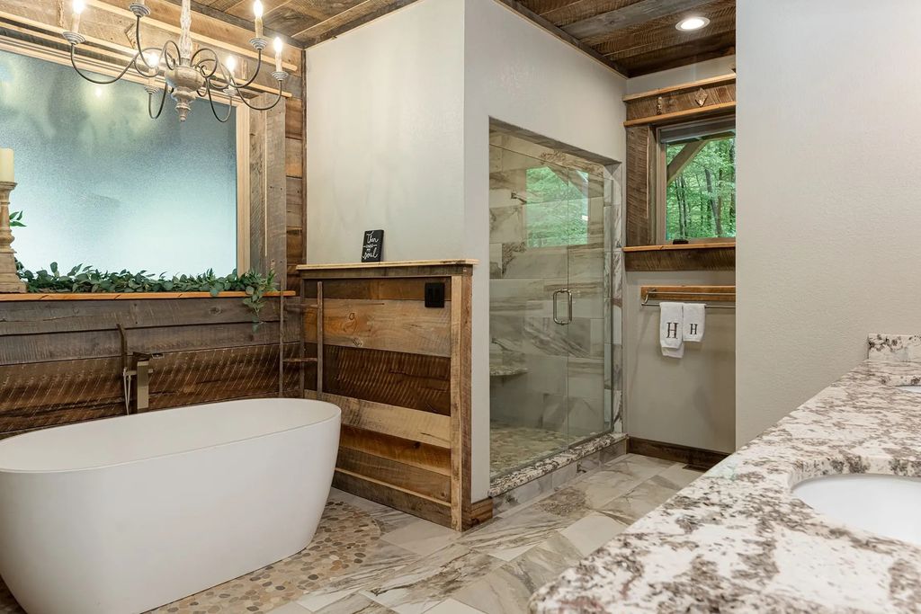 The Estate in Canton incorporates elements from the land with sustainable materials, now available for sale. This home located at 16 Gihon Waters Trl, Canton, North Carolina