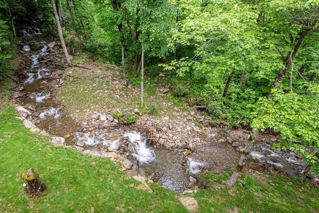 The Estate in Canton incorporates elements from the land with sustainable materials, now available for sale. This home located at 16 Gihon Waters Trl, Canton, North Carolina