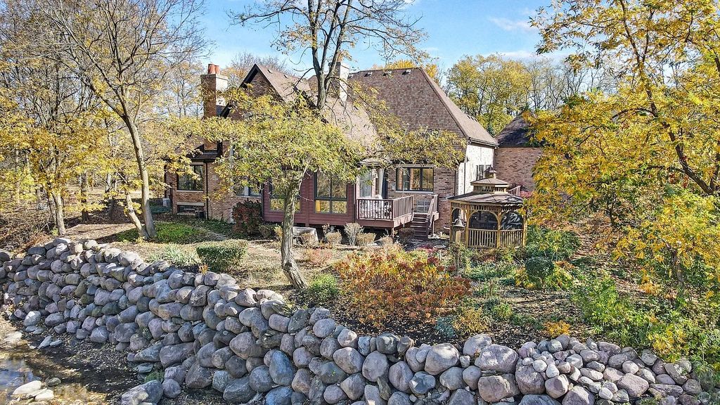 The Residence in Morris is surrounded by majestic, mature trees leading to your own private paradise, now available for sale. This home located at 4965 Cemetery Rd, Morris, Illinois