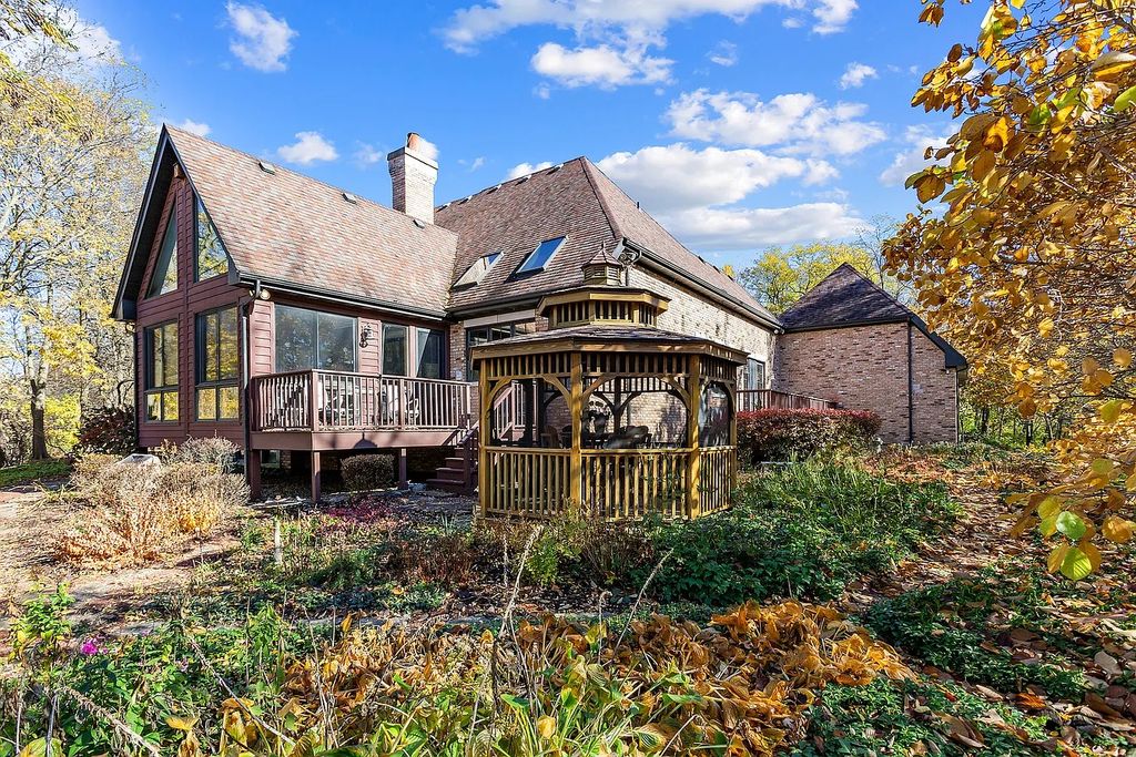 The Residence in Morris is surrounded by majestic, mature trees leading to your own private paradise, now available for sale. This home located at 4965 Cemetery Rd, Morris, Illinois