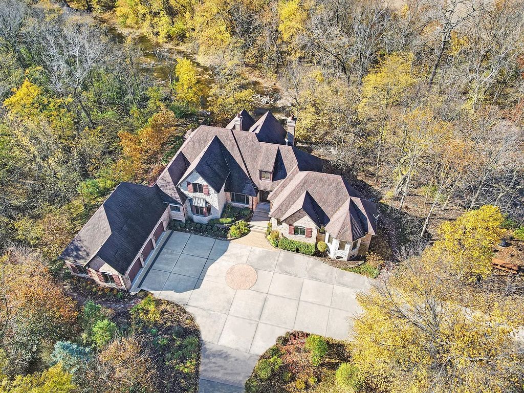 The Residence in Morris is surrounded by majestic, mature trees leading to your own private paradise, now available for sale. This home located at 4965 Cemetery Rd, Morris, Illinois