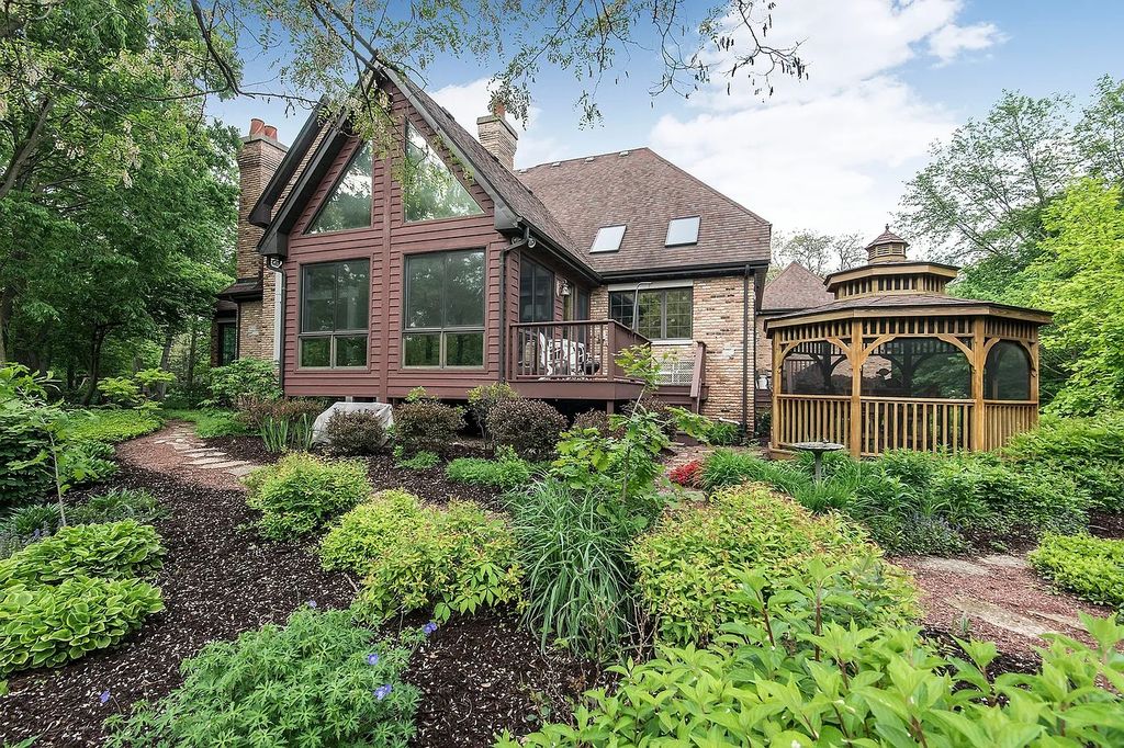 The Residence in Morris is surrounded by majestic, mature trees leading to your own private paradise, now available for sale. This home located at 4965 Cemetery Rd, Morris, Illinois