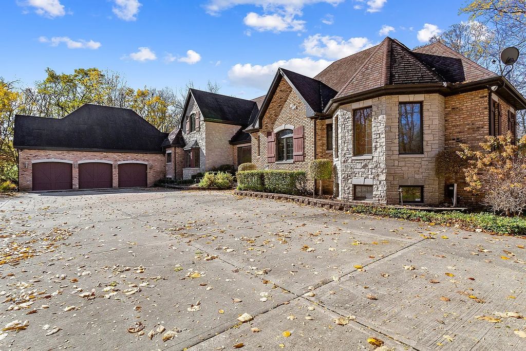 The Residence in Morris is surrounded by majestic, mature trees leading to your own private paradise, now available for sale. This home located at 4965 Cemetery Rd, Morris, Illinois