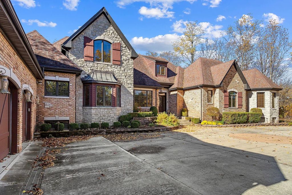 The Residence in Morris is surrounded by majestic, mature trees leading to your own private paradise, now available for sale. This home located at 4965 Cemetery Rd, Morris, Illinois