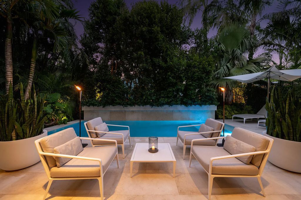 1025 Von Phister Street, Key West, Florida, is located in a sought-after neighborhood offering a tranquil escape. Both in the front and back yards, it is surrounded by lush tropical gardens.