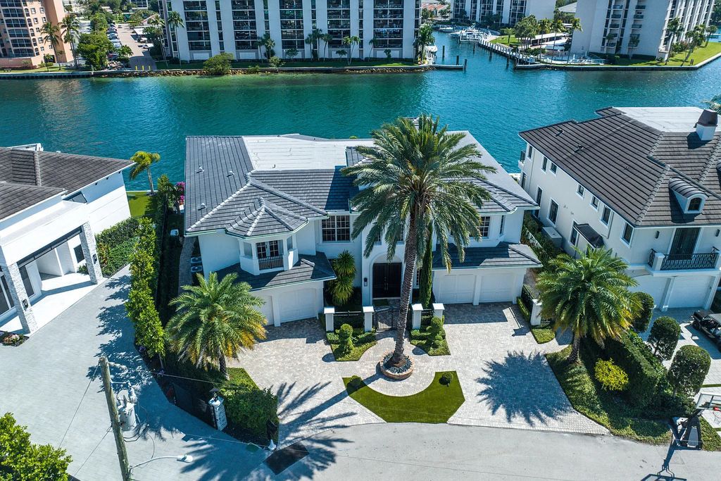 This exquisite 5 bedroom, 6 bathroom home is located on a prime waterfront lot in the highly sought-after area of Boca Raton, Florida. Built in 2003, 794 NE Harbour Drive boasts over 6,000 square feet of living space and sits on a spacious 0.22-acre lot. Upon entering the home, you'll be greeted by soaring ceilings and breathtaking water views that extend throughout the living areas, creating a bright and airy atmosphere.