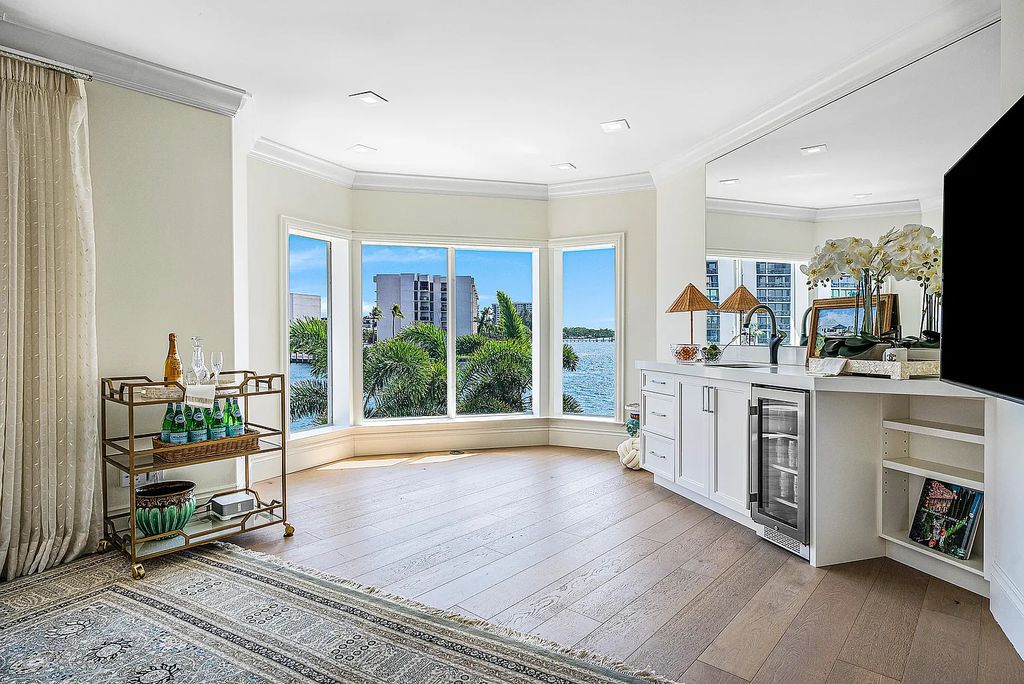 This exquisite 5 bedroom, 6 bathroom home is located on a prime waterfront lot in the highly sought-after area of Boca Raton, Florida. Built in 2003, 794 NE Harbour Drive boasts over 6,000 square feet of living space and sits on a spacious 0.22-acre lot. Upon entering the home, you'll be greeted by soaring ceilings and breathtaking water views that extend throughout the living areas, creating a bright and airy atmosphere.