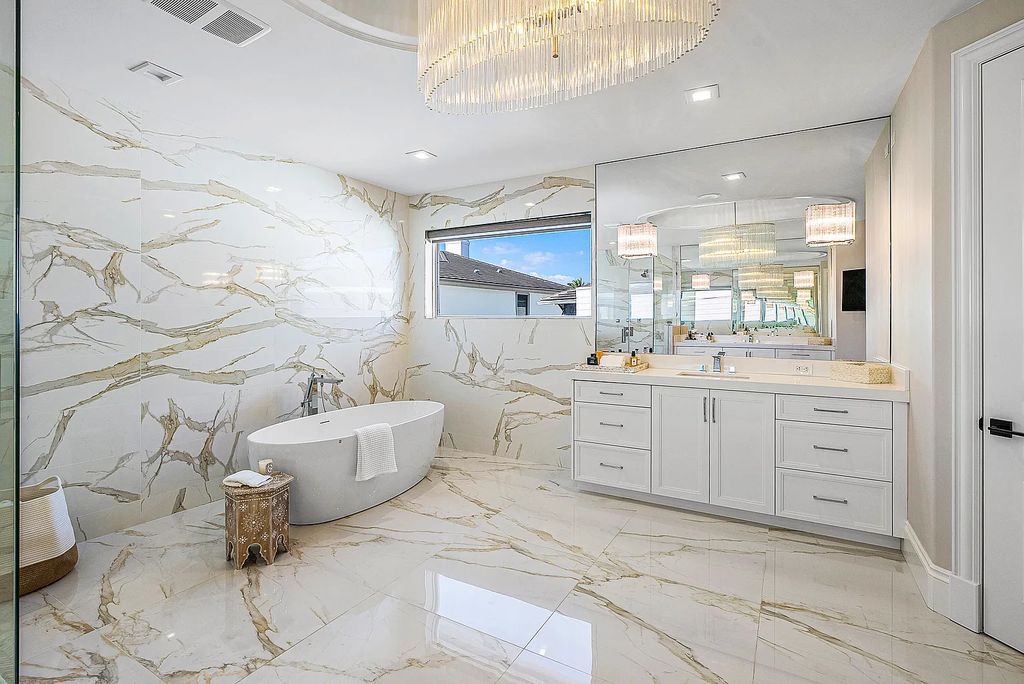This exquisite 5 bedroom, 6 bathroom home is located on a prime waterfront lot in the highly sought-after area of Boca Raton, Florida. Built in 2003, 794 NE Harbour Drive boasts over 6,000 square feet of living space and sits on a spacious 0.22-acre lot. Upon entering the home, you'll be greeted by soaring ceilings and breathtaking water views that extend throughout the living areas, creating a bright and airy atmosphere.