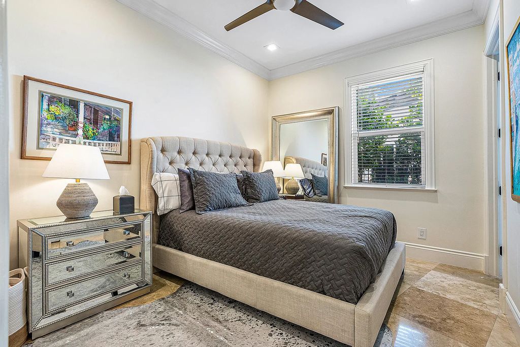 This exquisite 5 bedroom, 6 bathroom home is located on a prime waterfront lot in the highly sought-after area of Boca Raton, Florida. Built in 2003, 794 NE Harbour Drive boasts over 6,000 square feet of living space and sits on a spacious 0.22-acre lot. Upon entering the home, you'll be greeted by soaring ceilings and breathtaking water views that extend throughout the living areas, creating a bright and airy atmosphere.