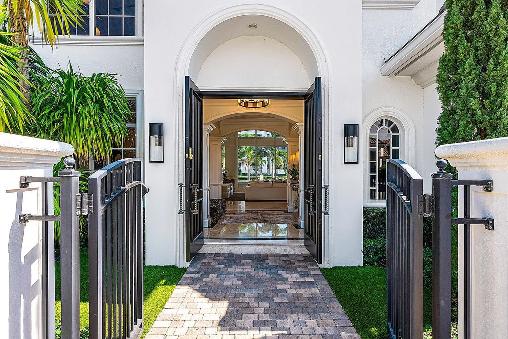This exquisite 5 bedroom, 6 bathroom home is located on a prime waterfront lot in the highly sought-after area of Boca Raton, Florida. Built in 2003, 794 NE Harbour Drive boasts over 6,000 square feet of living space and sits on a spacious 0.22-acre lot. Upon entering the home, you'll be greeted by soaring ceilings and breathtaking water views that extend throughout the living areas, creating a bright and airy atmosphere.