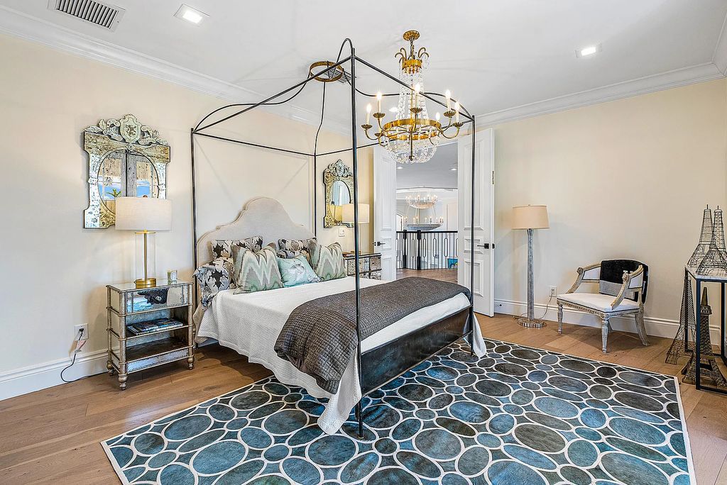 This exquisite 5 bedroom, 6 bathroom home is located on a prime waterfront lot in the highly sought-after area of Boca Raton, Florida. Built in 2003, 794 NE Harbour Drive boasts over 6,000 square feet of living space and sits on a spacious 0.22-acre lot. Upon entering the home, you'll be greeted by soaring ceilings and breathtaking water views that extend throughout the living areas, creating a bright and airy atmosphere.