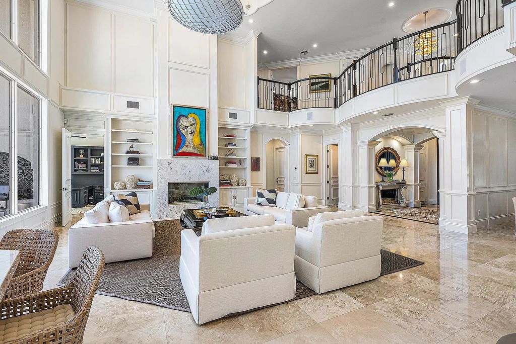 This exquisite 5 bedroom, 6 bathroom home is located on a prime waterfront lot in the highly sought-after area of Boca Raton, Florida. Built in 2003, 794 NE Harbour Drive boasts over 6,000 square feet of living space and sits on a spacious 0.22-acre lot. Upon entering the home, you'll be greeted by soaring ceilings and breathtaking water views that extend throughout the living areas, creating a bright and airy atmosphere.