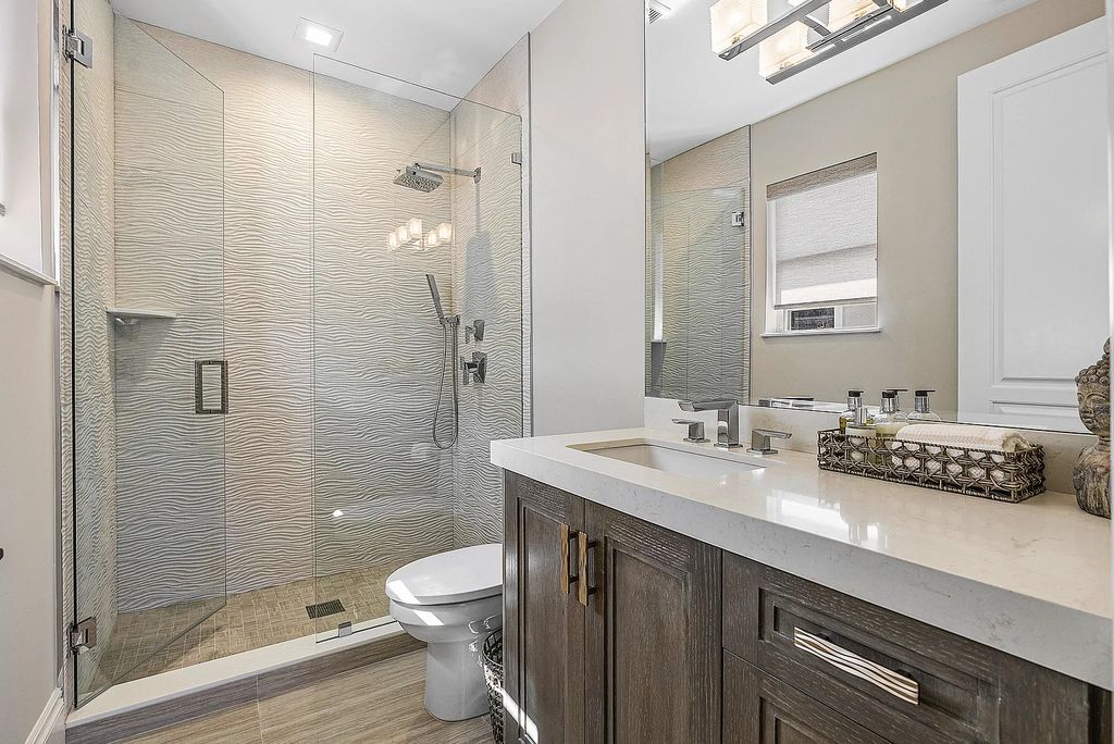 This exquisite 5 bedroom, 6 bathroom home is located on a prime waterfront lot in the highly sought-after area of Boca Raton, Florida. Built in 2003, 794 NE Harbour Drive boasts over 6,000 square feet of living space and sits on a spacious 0.22-acre lot. Upon entering the home, you'll be greeted by soaring ceilings and breathtaking water views that extend throughout the living areas, creating a bright and airy atmosphere.