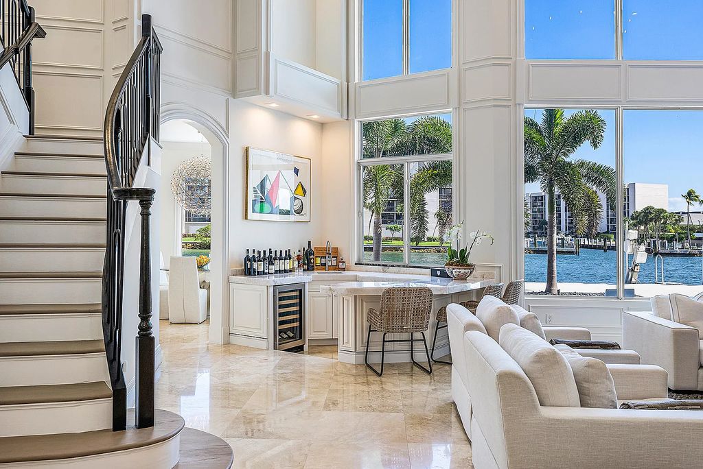 This exquisite 5 bedroom, 6 bathroom home is located on a prime waterfront lot in the highly sought-after area of Boca Raton, Florida. Built in 2003, 794 NE Harbour Drive boasts over 6,000 square feet of living space and sits on a spacious 0.22-acre lot. Upon entering the home, you'll be greeted by soaring ceilings and breathtaking water views that extend throughout the living areas, creating a bright and airy atmosphere.
