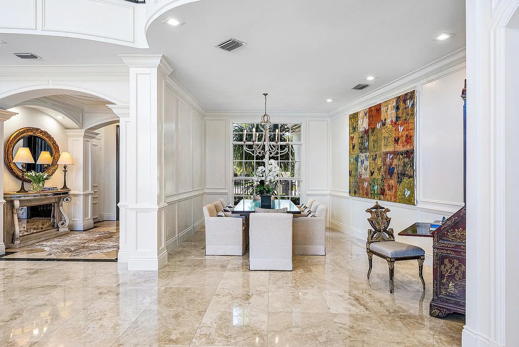 This exquisite 5 bedroom, 6 bathroom home is located on a prime waterfront lot in the highly sought-after area of Boca Raton, Florida. Built in 2003, 794 NE Harbour Drive boasts over 6,000 square feet of living space and sits on a spacious 0.22-acre lot. Upon entering the home, you'll be greeted by soaring ceilings and breathtaking water views that extend throughout the living areas, creating a bright and airy atmosphere.