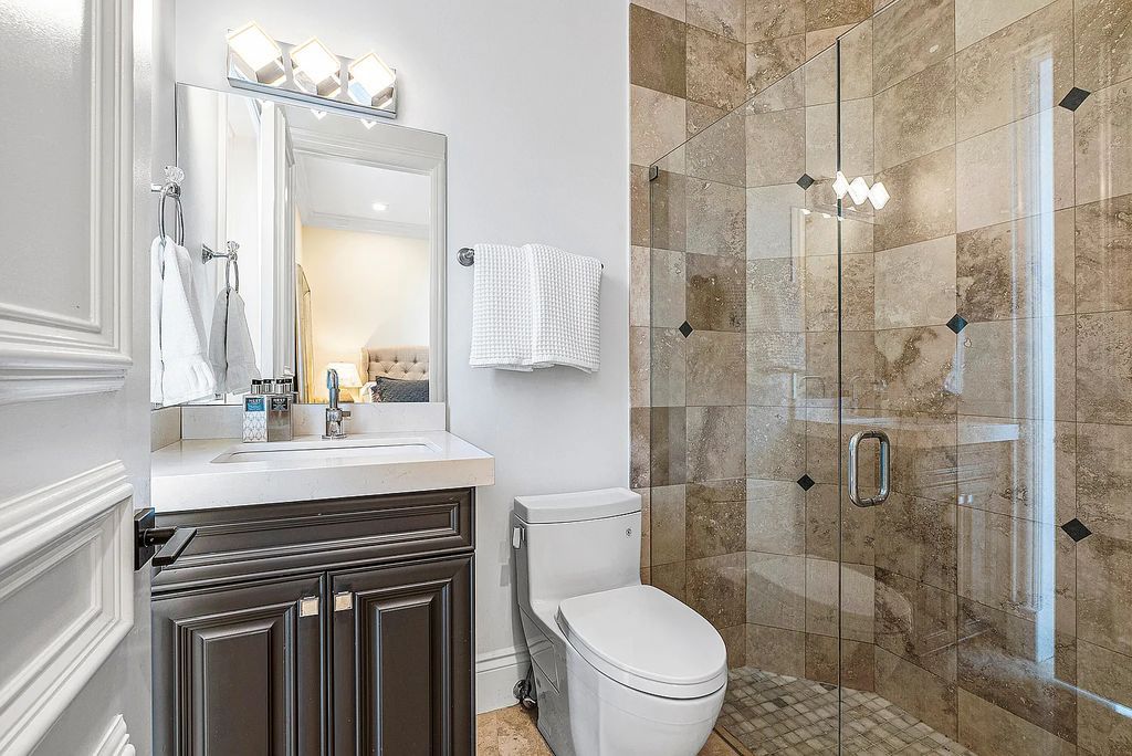 This exquisite 5 bedroom, 6 bathroom home is located on a prime waterfront lot in the highly sought-after area of Boca Raton, Florida. Built in 2003, 794 NE Harbour Drive boasts over 6,000 square feet of living space and sits on a spacious 0.22-acre lot. Upon entering the home, you'll be greeted by soaring ceilings and breathtaking water views that extend throughout the living areas, creating a bright and airy atmosphere.