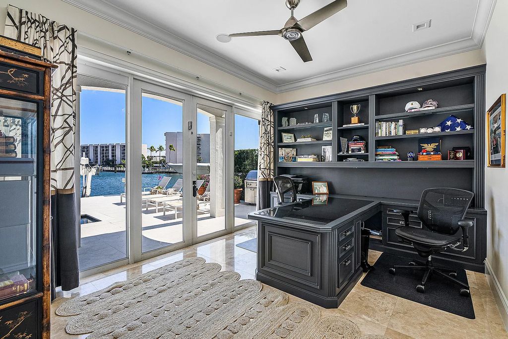 This exquisite 5 bedroom, 6 bathroom home is located on a prime waterfront lot in the highly sought-after area of Boca Raton, Florida. Built in 2003, 794 NE Harbour Drive boasts over 6,000 square feet of living space and sits on a spacious 0.22-acre lot. Upon entering the home, you'll be greeted by soaring ceilings and breathtaking water views that extend throughout the living areas, creating a bright and airy atmosphere.