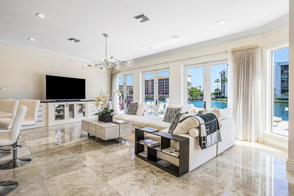 This exquisite 5 bedroom, 6 bathroom home is located on a prime waterfront lot in the highly sought-after area of Boca Raton, Florida. Built in 2003, 794 NE Harbour Drive boasts over 6,000 square feet of living space and sits on a spacious 0.22-acre lot. Upon entering the home, you'll be greeted by soaring ceilings and breathtaking water views that extend throughout the living areas, creating a bright and airy atmosphere.