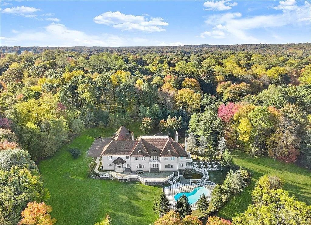 The Chateau in Armonk exudes warmth and luxurious comfort from the minute you enter, now available for sale. This home located at 4 Cowdray Park Drive, Armonk, New York
