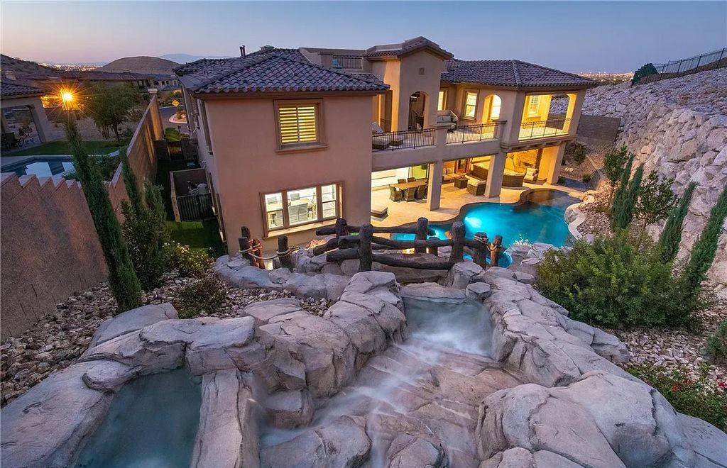 89 Olympia Chase Drive, Las Vegas, Nevada is a stunning executive home in the highly sought-after Southern Highlands Country Club Community with many designer finishes throughout for entertaining and relaxing.