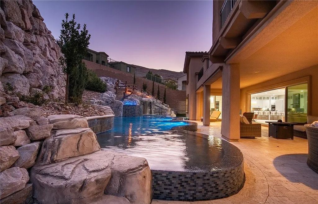 89 Olympia Chase Drive, Las Vegas, Nevada is a stunning executive home in the highly sought-after Southern Highlands Country Club Community with many designer finishes throughout for entertaining and relaxing.